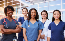 caregivers and nurses standing smiling