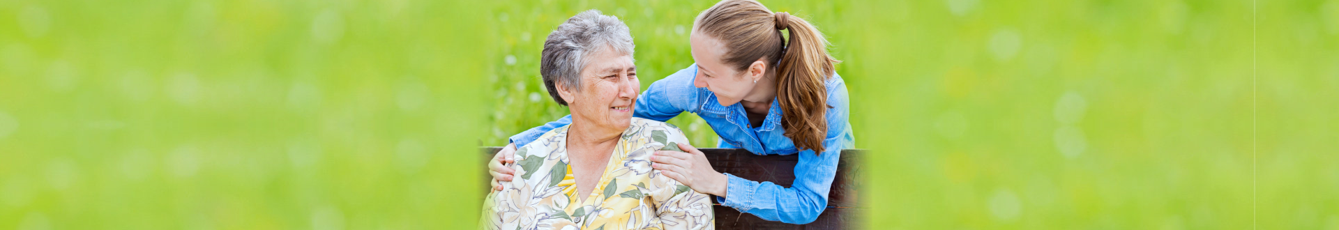 caregiver and senior woman smiling