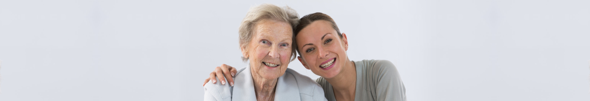 caregiver and senior woman smiling