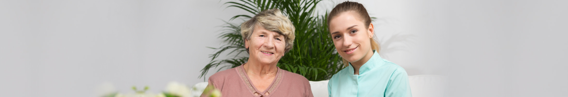 caregiver and senior woman smiling